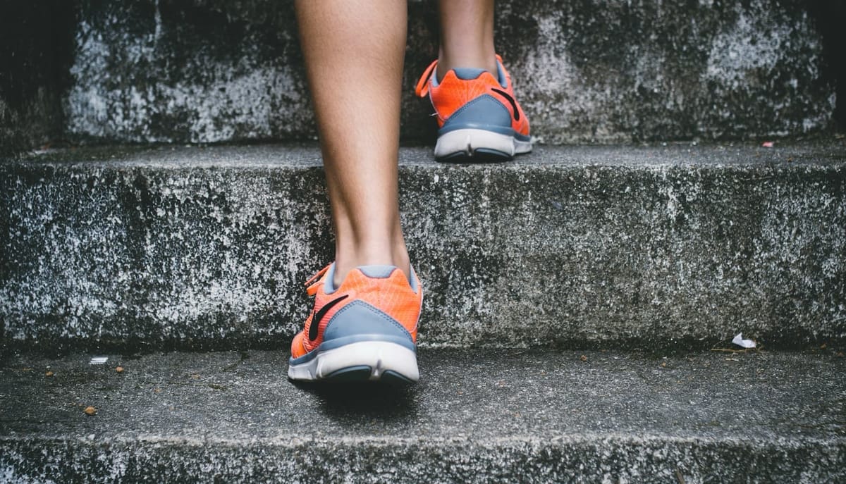 Closeup of feet climbing stairs