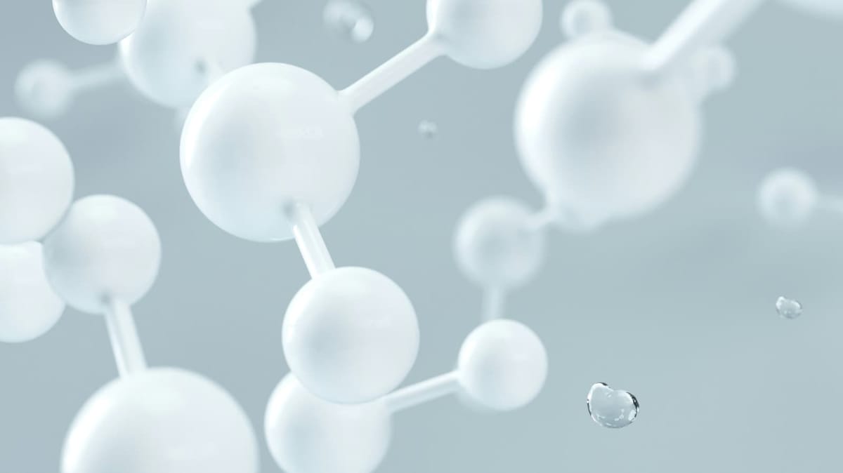 White spheres with rods connecting them on a grey background.