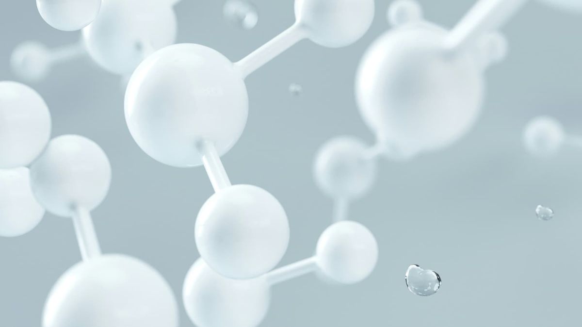 White spheres with rods connecting them on a grey background.